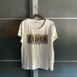 White, thin, oversized graphic tee.